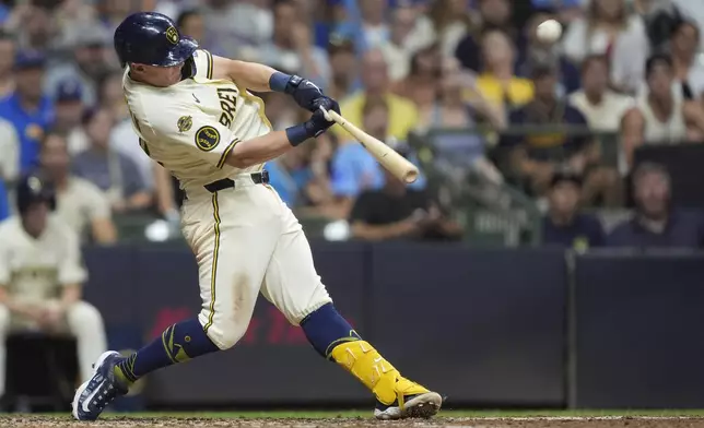 Milwaukee Brewers' Andrew Vaughn hits a grand slam during the sixth inning of a baseball game against the Chicago Cubs, Tuesday, July 29, 2025, in Milwaukee. (AP Photo/Aaron Gash)