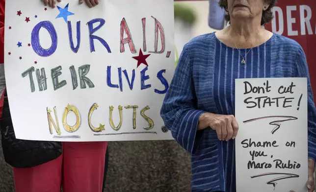FILE - Federal workers and supporters rally outside of the State Department, June 27, 2025, in Washington. (AP Photo/Mark Schiefelbein, File)