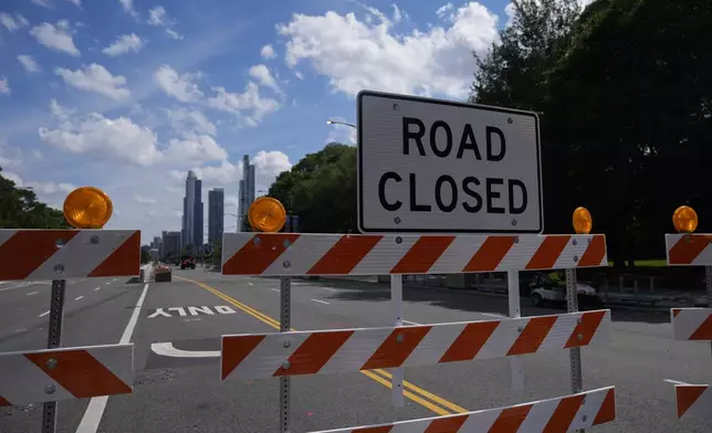 Construction of the street course continues ahead of the NASCAR auto racs, Friday, June 27, 2025, in downtown Chicago. (AP Photo/Erin Hooley)