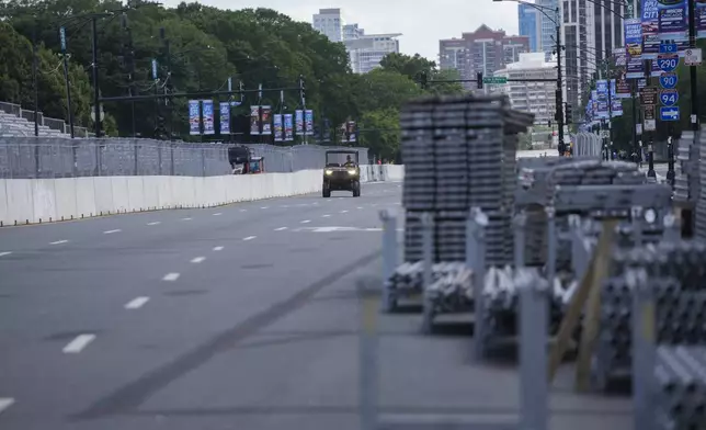 Construction of the street course continues ahead of the NASCAR auto racs, Friday, June 27, 2025, in downtown Chicago. (AP Photo/Erin Hooley)