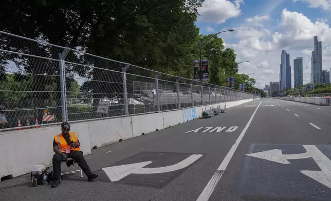 Construction of the street course continues ahead of the NASCAR auto racs, Friday, June 27, 2025, in downtown Chicago. (AP Photo/Erin Hooley)