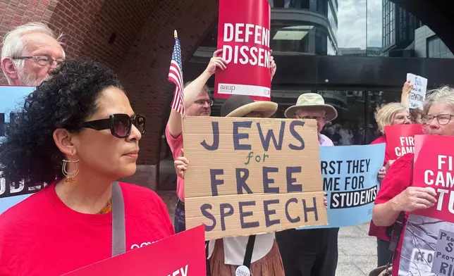 People show their support for a lawsuit challenging the Trump administration's policy of targeting students for deportation who took part in pro-Palestinian demonstrations on Monday, July 7, 2025, at the federal courthouse in Boston. (AP Photo/Michael Casey)