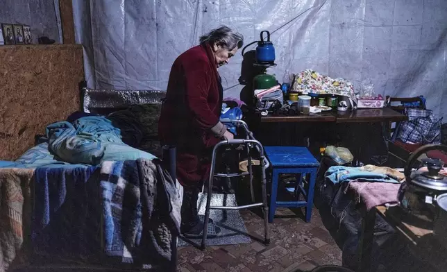 FILE - In this photo provided by Ukraine's 93rd Kholodnyi Yar Separate Mechanized Brigade press service, a woman takes shelter in the basement of an apartment building in Pokrovsk, the site of heavy battles with Russian troops, Donetsk region, Ukraine, March 25, 2025. (Iryna Rybakova/Ukraine's 93rd Mechanized Brigade via AP, File)