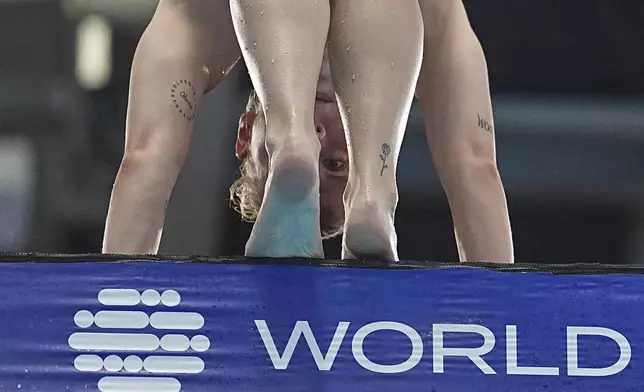 Pauline Alexandra Pfeif of Germany competes in the women's 10m platform diving preliminaries at the World Aquatics Championships in Singapore, Wednesday, July 30, 2025. (AP Photo/Ng Han Guan)