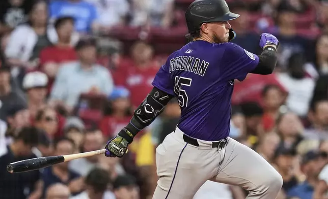Colorado Rockies' Hunter Goodman singles during the fourth inning of a baseball game against the Boston Red Sox at Fenway Park, Tuesday, July 8, 2025, in Boston. (AP Photo/Charles Krupa)