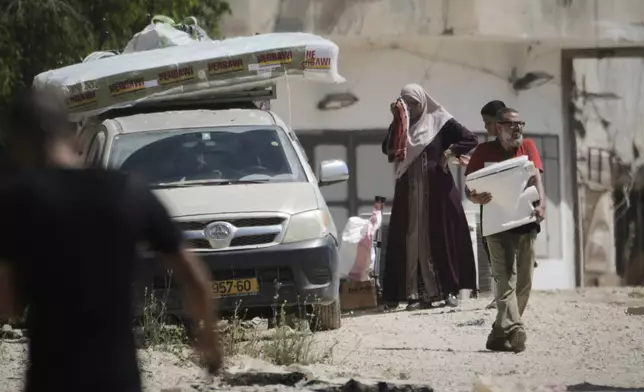 Palestinians gather their belongings ahead of homes demolition by Israeli forces in the Tulkarem refugee camp, West Bank, Wednesday, July 2, 2025. (AP Photo/Majdi Mohammed)