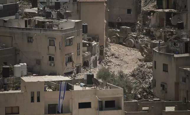 Destroyed houses during the Israeli forces ground operations are seen at the Nur Shams refugee camp, in the West Bank city of Tulkarem, Wednesday, July 2, 2025. (AP Photo/Leo Correa)