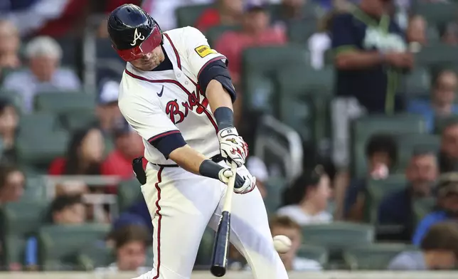 Atlanta Braves' Austin Riley hits a single in the fourth inning of a baseball game against the Los Angeles Angels, Tuesday, July 1, 2025, in Atlanta. (AP Photo/Colin Hubbard)