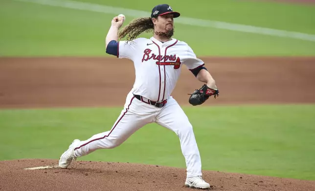 Atlanta Braves pitcher Grant Holmes delivers in the first inning of a baseball game against the Los Angeles Angels, Tuesday, July 1, 2025, in Atlanta. (AP Photo/Colin Hubbard)