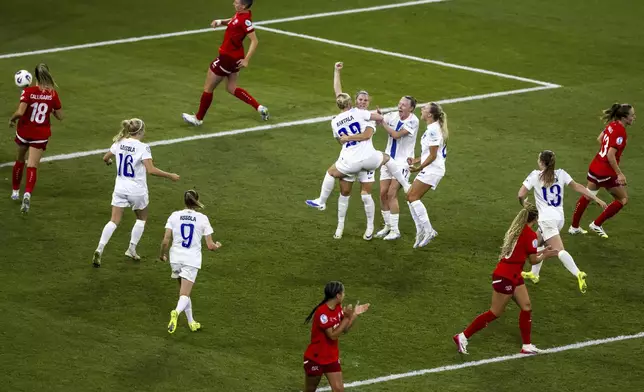 Finland's Natalia Kuikka raises a fist after scoring the opening goal during the UEFA Women's EURO 2025, group A, soccer match between Finland and Switzerland in Geneva, Switzerland, Thursday, July 10, 2025. (Martial Trezzini/Keystone via AP)