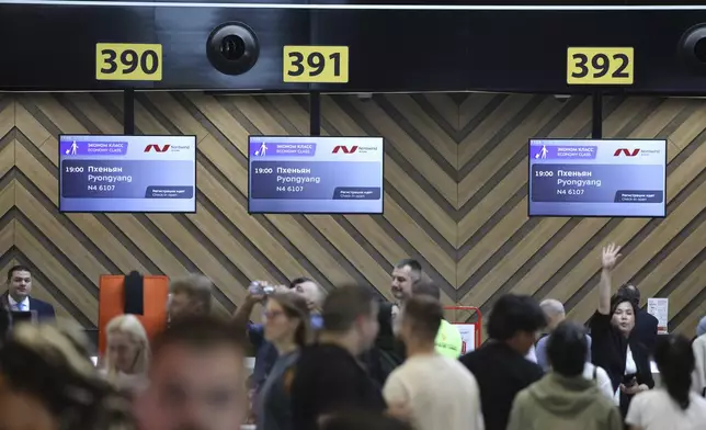 Passengers gather to check-in for the first flight connecting Moscow and Pyongyang at Moscow's Sheremetyevo International airport amidst the warming relations between Russia and North Korea outside Moscow, Russia, Sunday, July 27, 2025. (AP Photo)