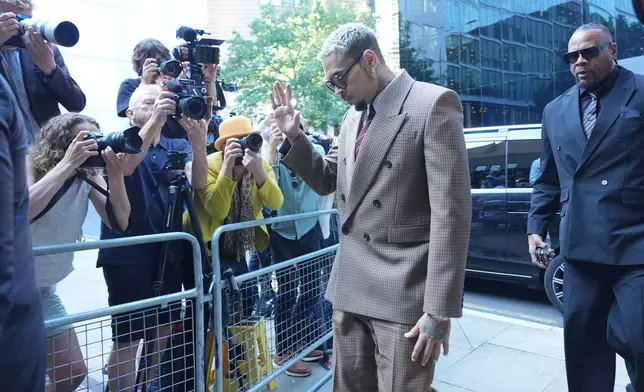 US R&amp;B singer Chris Brown arrives at Southwark Crown Court, south London, Friday July 11, 2025, where he is charged over an alleged assault in a London nightclub. (James Manning/PA via AP)