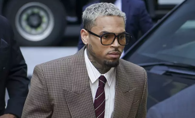 Grammy-winning singer Chris Brown makes his way into Southwark Crown Court, in London, Friday, July 11, 2025.(AP Photo/Alberto Pezzali)