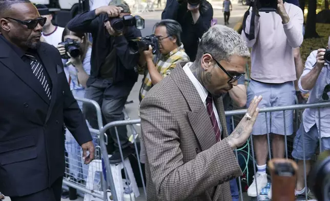 Grammy-winning singer Chris Brown makes his way into Southwark Crown Court, in London, Friday, July 11, 2025.(AP Photo/Alberto Pezzali)