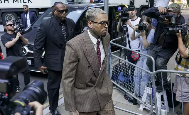 Grammy-winning singer Chris Brown makes his way into Southwark Crown Court, in London, Friday, July 11, 2025.(AP Photo/Alberto Pezzali)
