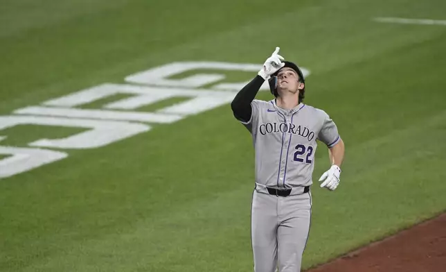Colorado Rockies' Mickey Moniak gestures as he runs the bases after hitting a home run off Baltimore Orioles pitcher Dean Kremer during the third inning of a baseball game in Baltimore, Friday, July 25, 2025. (AP Photo/Terrance Williams)
