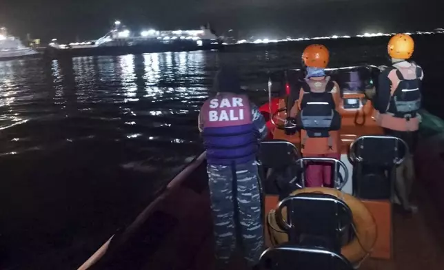In this photo released by the Indonesian National Search and Rescue Agency (BASARNAS) rescuers search for victims after a ferry enroute for the resort island of Bali sank off Ketapang, East Java, Indonesia, early Thursday, July 3, 2025. (BASARNAS via AP)