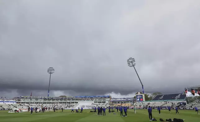 Dark clouds loom over Edgbaston cricket ground as players train before the start of play on day five of the second cricket test match between England and India in Birmingham, England, Sunday, July 6, 2025. (AP Photo/Scott Heppell)