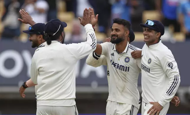 India's Akash Deep, second right, celebrates with teammates after the dismissal of England's Jamie Smith on day five of the second cricket test match between England and India at Edgbaston in Birmingham, England, Sunday, July 6, 2025. (AP Photo/Scott Heppell)