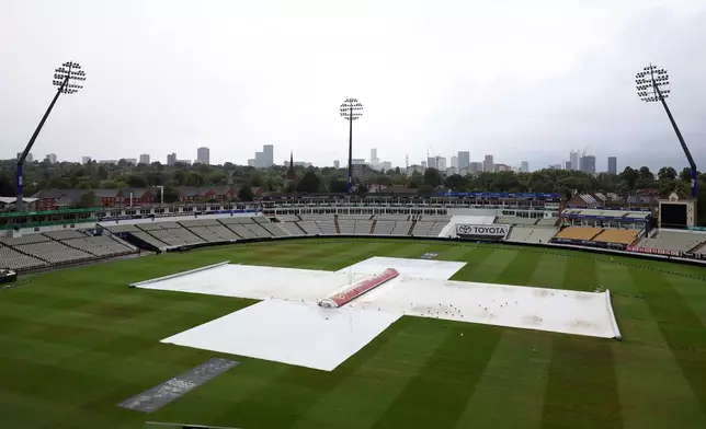 A general view of the field of play with the rain covers on due to the rain ahead of day five of the second cricket test match between England and India at Edgbaston in Birmingham, England, Sunday, July 6, 2025. (AP Photo/Scott Heppell)