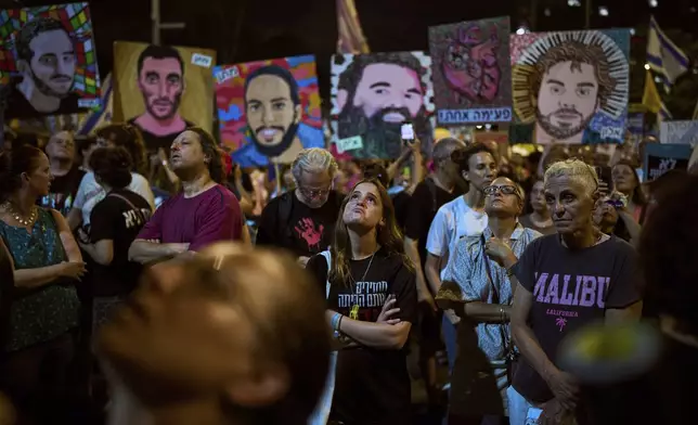 Relatives and supporters of Israeli hostages held in the Gaza Strip attend a rally demanding their release from Hamas captivity and calling for an end to the war, in Tel Aviv, Israel, Saturday, July 12, 2025. (AP Photo/Oded Balilty)
