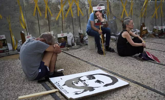 Relatives and supporters of Israeli hostages held in the Gaza Strip attend a rally demanding their release from Hamas captivity and calling for an end to the war, in Tel Aviv, Israel, Saturday, July 12, 2025. (AP Photo/Oded Balilty)