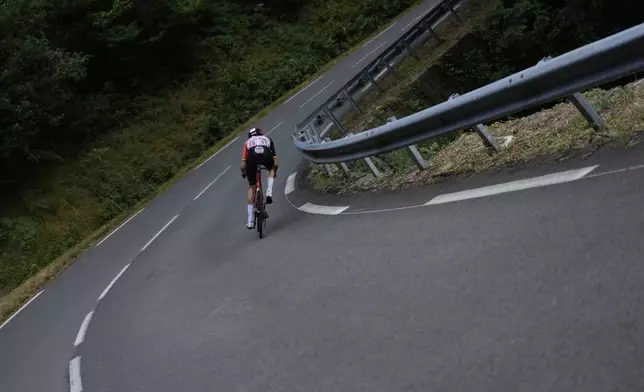 Belgium's Tim Wellens speeds downhill as he leads during the fifteenth stage of the Tour de France cycling race over 169.3 kilometers (105.2 miles) with start in Muret and finish in Carcassone, France, Sunday, July 20, 2025. (AP Photo/Mosa'ab Elshamy)