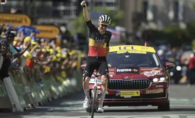 Belgium's Tim Wellens crosses the finish line to win the fifteenth stage of the Tour de France cycling race over 169.3 kilometers (105.2 miles) with start in Muret and finish in Carcassone, France, Sunday, July 20, 2025. (AP Photo/Thibault Camus)