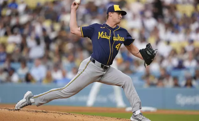 Milwaukee Brewers starting pitcher Quinn Priester throws to the plate during the first inning of a baseball game against the Los Angeles Dodgers, Friday, July 18, 2025, in Los Angeles. (AP Photo/Mark J. Terrill)