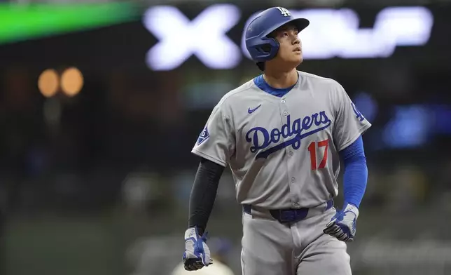 Los Angeles Dodgers' Shohei Ohtani looks on during the eighth inning of a baseball game against the Milwaukee Brewers, Monday, July 7, 2025, in Milwaukee. (AP Photo/Aaron Gash)