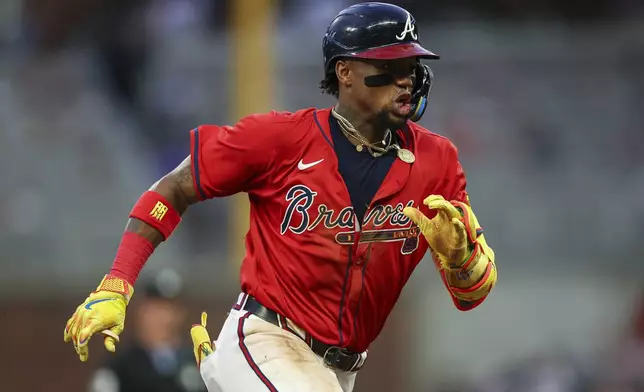 Atlanta Braves' Ronald Acuña Jr. runs to third base in the fourth inning of a baseball game against the New York Yankees, Friday, July 18, 2025, in Atlanta. (AP Photo/Colin Hubbard)