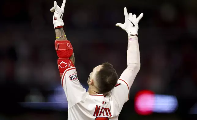 Los Angeles Angels' Zach Neto celebrates after driving in the winning run during the tenth inning of a baseball game against the Seattle Mariners Friday, July 25, 2025, in Anaheim, Calif. (AP Photo/Eric Thayer)