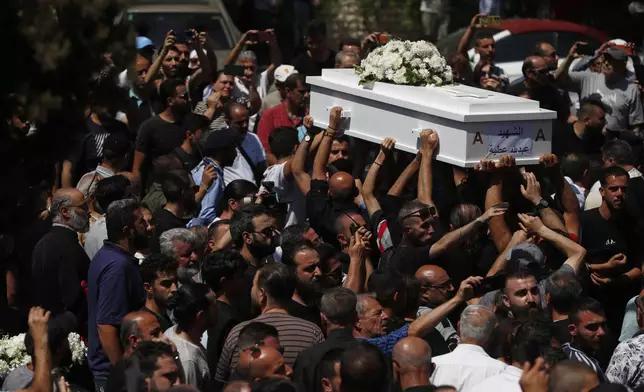 Mourners carry the coffin of a victim of the June 22 suicide bombing at Mar Elias Church during a funeral service at al-Saleeb Church in the al-Qasaa neighborhood of Damascus, Syria, June 24, 2025. (AP Photo/Omar Sanadiki)