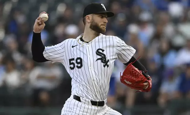 Chicago White Sox starter Sean Burke delivers a pitch during the first inning of a baseball game against the Toronto Blue Jays, Monday, July 7, 2025, in Chicago. (AP Photo/Paul Beaty)