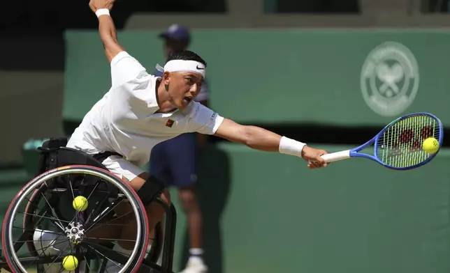 Tokito Oda of Japan returns to Alfie Hewett of Britain during the men's wheelchair singles final match at the Wimbledon Tennis Championships in London, Sunday, July 13, 2025.(AP Photo/Joanna Chan)