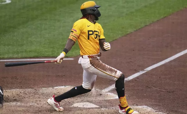 Pittsburgh Pirates' Oneil Cruz singles off Chicago White Sox pitcher Jonathan Cannon, driving in a run, during the fourth inning of a baseball game in Pittsburgh, Friday, July 18, 2025. (AP Photo/Gene J. Puskar)