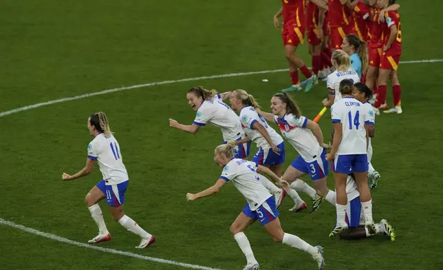 England players celebrate after winning the Women's Euro 2025 final soccer match between England and Spain at St. Jakob-Park in Basel, Switzerland, Sunday, July 27, 2025. (AP Photo/Michael Probst)