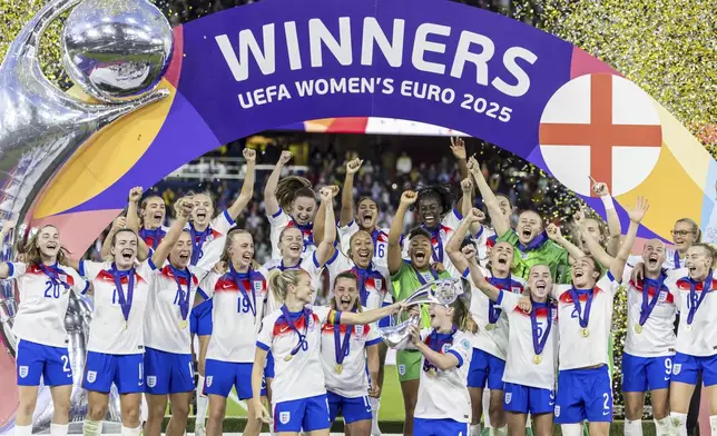 England players lift the trophy after after winning the Women's Euro 2025 final soccer match between England and Spain at St. Jakob-Park in Basel, Switzerland, Sunday, July 27, 2025. (Michael Buholzer/Keystone via AP)