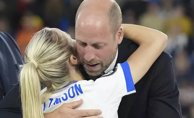 England's Leah Williamson hugs with Britain's Prince William after winning the Women's Euro 2025 final soccer match between England and Spain at St. Jakob-Park in Basel, Switzerland, Sunday, July 27, 2025. (AP Photo/Martin Meissner)