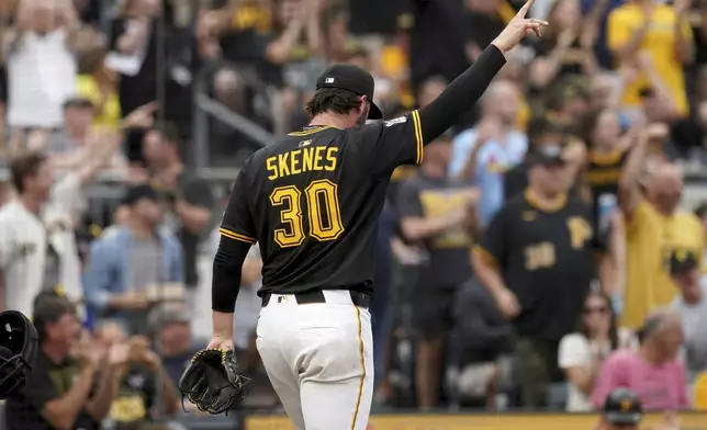 Pittsburgh Pirates pitcher Paul Skenes reacts after watching catcher Henry Davis tag out St. Louis Cardinals' Willson Contreras at home during the fourth inning of a baseball game, Tuesday, July 1, 2025, in Pittsburgh. (AP Photo/Matt Freed)