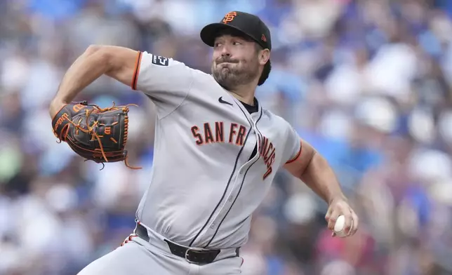 San Francisco Giants pitcher Robbie Ray (38) throws during the first inning of a baseball game against the Toronto Blue Jays in Toronto on Sunday, July 20, 2025. (Nathan Denette/The Canadian Press via AP)