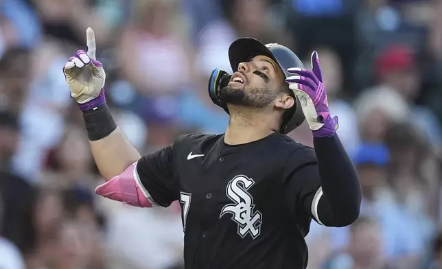 Chicago White Sox's Edgar Quero gestures as he crosses home plate after hitting a solo home run off Colorado Rockies starting pitcher Antonio Senzatela in the sixth inning of a baseball game Friday, July 4, 2025, in Denver. (AP Photo/David Zalubowski)