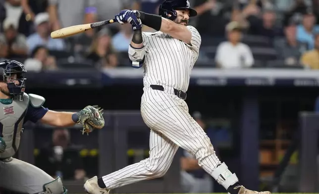 New York Yankees' Austin Wells (28) hits a single during the ninth inning of a baseball game against the Seattle Mariners, Thursday, July 10, 2025, in New York. (AP Photo/Yuki Iwamura)