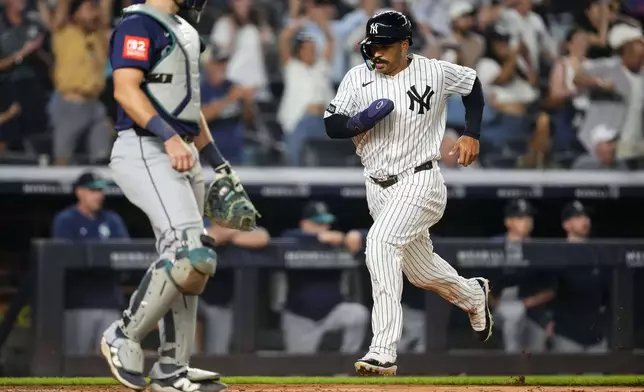 New York Yankees' Trent Grisham runs to home base during the ninth inning of a baseball game against the Seattle Mariners, Thursday, July 10, 2025, in New York. (AP Photo/Yuki Iwamura)