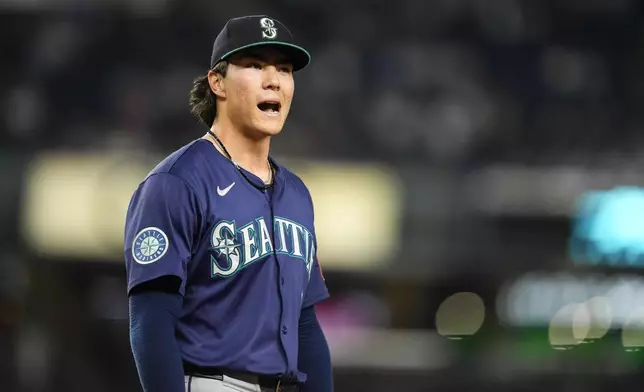Seattle Mariners pitcher Bryan Woo (22) reacts after missing no-hit during the eighth inning of a baseball game against the New York Yankees, Thursday, July 10, 2025, in New York. (AP Photo/Yuki Iwamura)