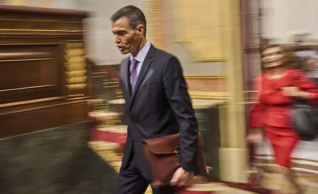 Spanish Prime Minister Pedro Sánchez arrives at the Spanish parliament in Madrid, Wednesday, July 9, 2025. (AP Photo/Bernat Armangue)