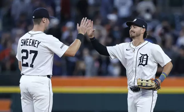 Detroit Tigers' Trey Sweeney, left, celebrates with Zach McKinstry, right, after a win over the Tampa Bay Rays in a baseball game Monday, July 7, 2025, in Detroit. (AP Photo/Duane Burleson)