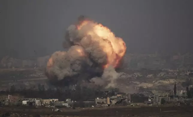 Smoke and fire rise to the sky following an Israeli army bombardment in the northern Gaza Strip, as seen from southern Israel, Thursday, July 10, 2025. (AP Photo/Leo Correa)