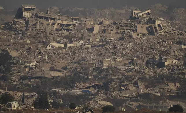 Buildings that were destroyed during the Israeli ground and air operations stand in northern of Gaza Strip as seen from southern Israel, Thursday, July 10, 2025. (AP Photo/Leo Correa)