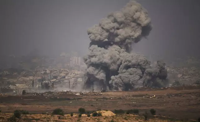 Smoke rises to the sky following an Israeli army bombardment in the northern Gaza Strip, as seen from southern Israel, Thursday, July 10, 2025. (AP Photo/Leo Correa)